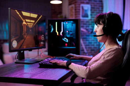 Female player having fun with action video games competition