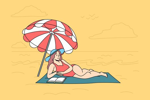 Happy woman in swimsuit lying on beach