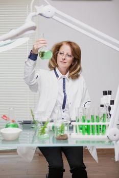 Portrait of middle age woman working in microbiology industry