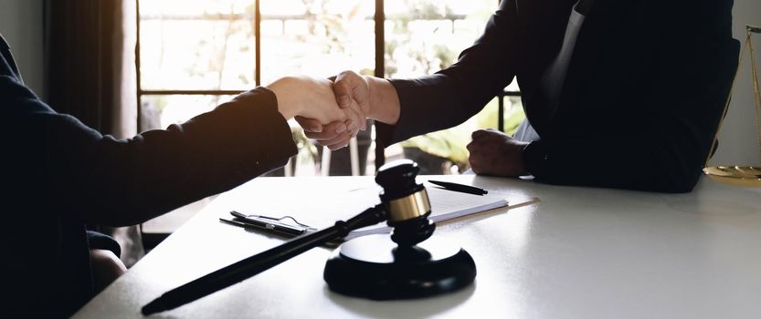Lawyer business women shaking hands with clients, after finishing up a Consulting for insurance rent house. concept of home protection, family, insurance.