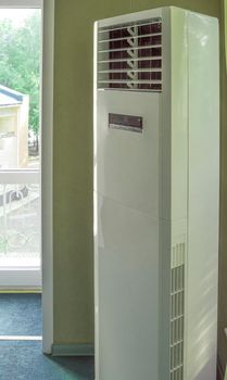 Vertical split system column air conditioner close-up for office, industrial premises and gyms