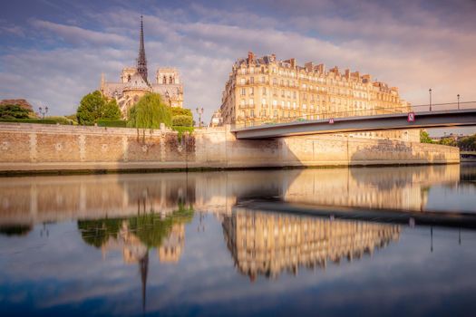 Notre Dame Cathedral on Seine River at sunrise, Paris, France