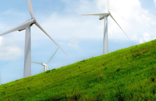 Wind energy. Wind power. Sustainable, renewable energy. Wind turbines generate electricity. Windmill farm with blue sky. Renewable resource. Sustainable development. Global energy crisis concept.