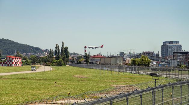 Landing a passenger aircraft through a busy motorway and industrial zone