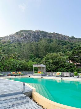 Swimming pool on roof top with beautiful mountain view.