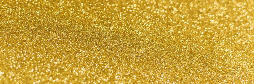 Golden shiny background. gold glitter texture christmas abstract background. Web banner