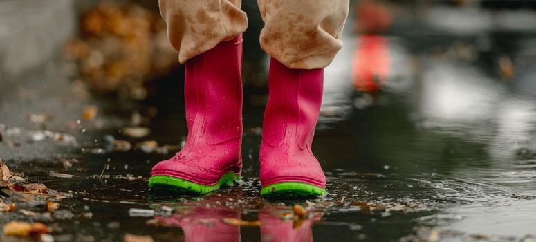 Child in rubber boots