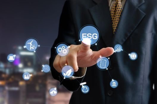 business idea. man touching  icon  ESG word  a virtual screen.Environmental, social, and governance (ESG) investment Organizational growth.  