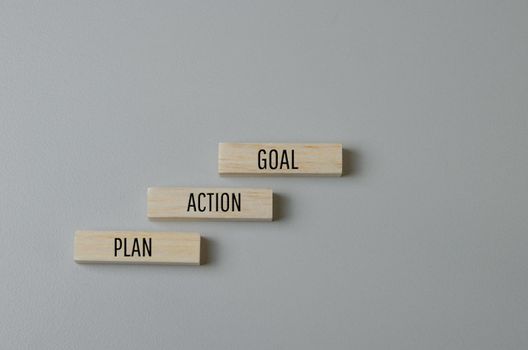 Wooden blocks with words Plan Action Goal on background and copy space.Business concepts.