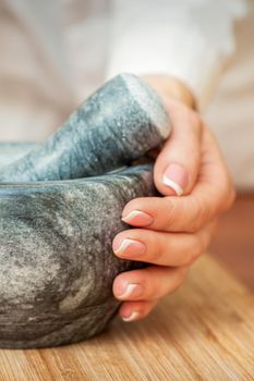 Mortar and pestle in hands