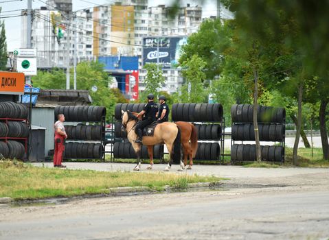 Ukraine, Kyiv 07.03.2022 mounted police at repairing service garage background