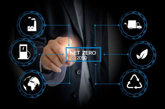 Businessman touching net zero save the eco world and reduce pollution virtual screen. virtual screen Business Technology Concept. 
