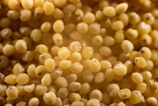 Millet groats in extreme close-up. Top view.