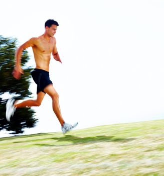 Muscular young man running outdoors - Copyspace. Portrait of a muscular young man running outdoors - Copyspace.