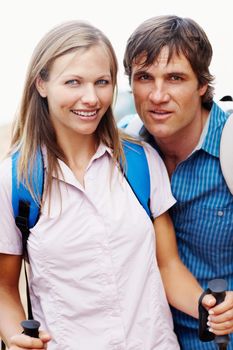 Ready for hiking. Portrait of cute couple with backpack ready for hiking.