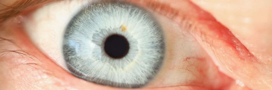 Light blue human eye colour, extreme macro shot of persons vision