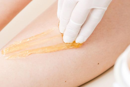 sugaring wax at a professional cosmetologist