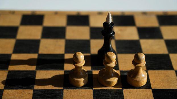 Close-up of chess pieces on the board.