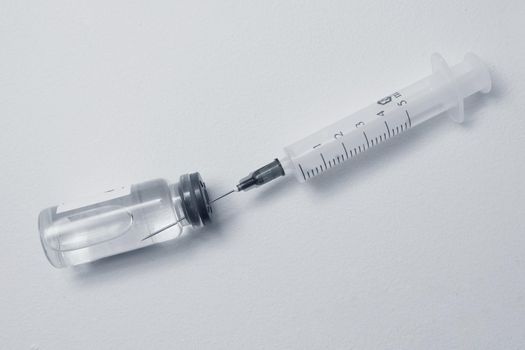 Syringe and Bottles on white background.