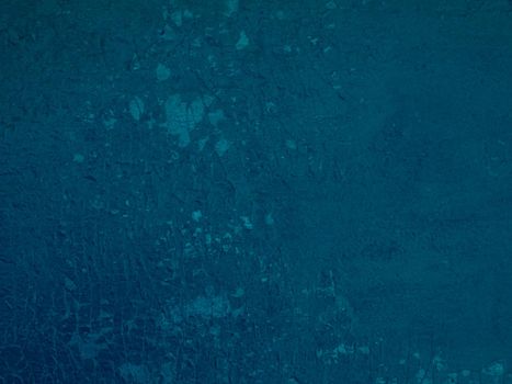 Abstract background of shabby shabby blue paint on wall.