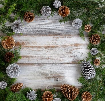 Real fir wreath with gold and silver pinecone ornaments for the Christmas or New Year holiday 