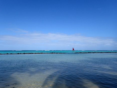 Pahonu Pond (Ancient Hawaiian Fishpond) with Sail boat in the distance