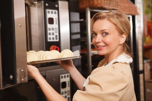 Female baker at her store