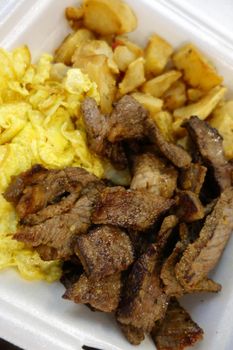 Kiawe grilled steak, scrambled eggs, country fried potatoes