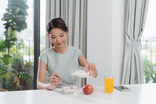 Young woman prepares a low-calorie breakfast on a prescription 
