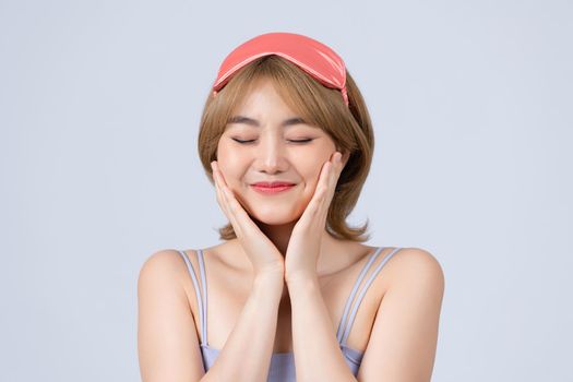 Smiling young woman with closed eyes wake up concept.