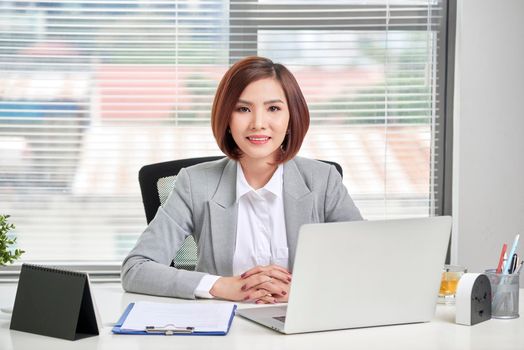 Business Woman using her Laptop Computer at office. Business People