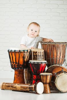 Cute baby playing drums