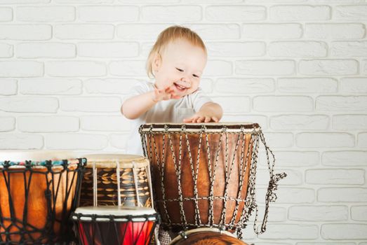 Cute baby playing drums