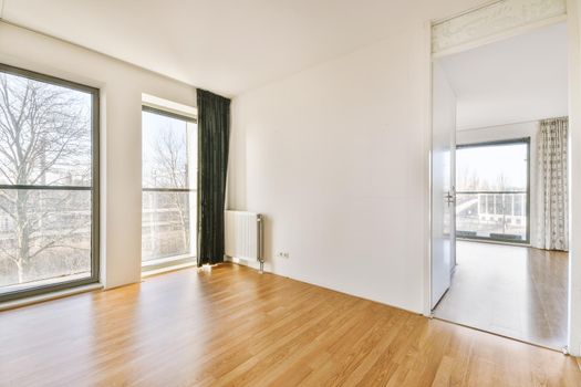 Empty room with white walls and parquet floor