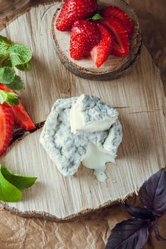 gourmet goat cheese with mold and soft liquid core