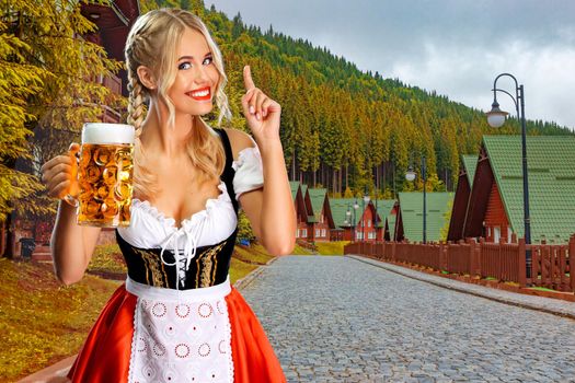 Oktoberfest girl waitress with beer, wearing a traditional Bavarian or german dirndl, serving big mug with drink outdoor. Octoberfest party.