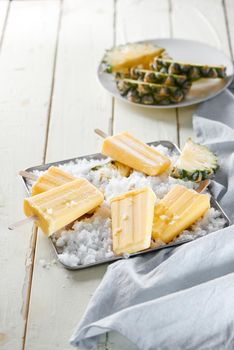 Delicious Homemade Pineapple Popsicles on Ice Cubes 