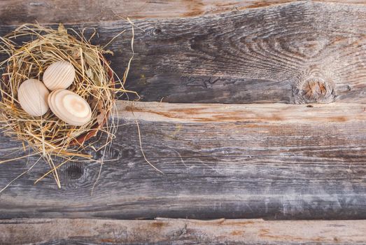Easter decoration wooden eggs in nest