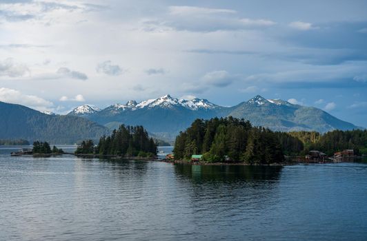 Snow capped mountains above the islands in the Sitka bay