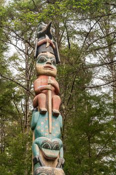Detail of carved totem pole in the Sitka National Historical Park in Alaska