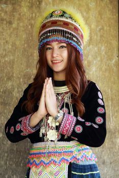 Traditionally dressed Mhong hill tribe woman pay respect
