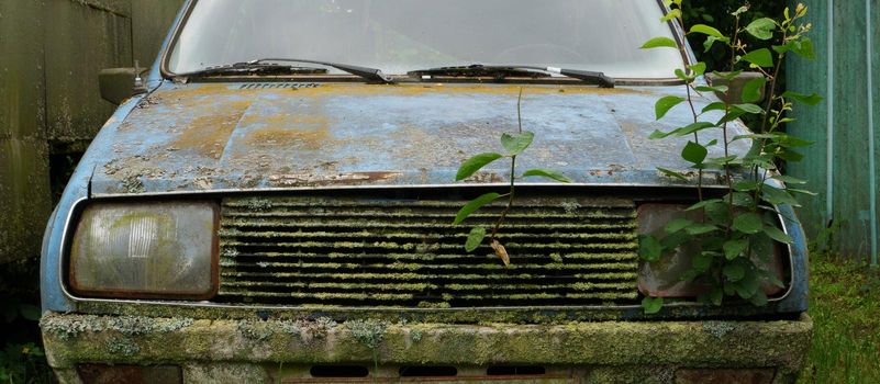An old faulty car in an abandoned farm.
