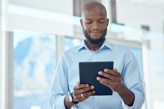 Businessman using digital tablet in office. Young businessman using digital tablet in office.