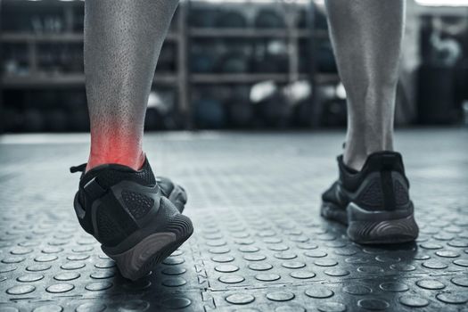 An ankle sprain from one wrong move. Exercise can result in muscle strain. Closeup on foot pain of a bodybuilder in the gym. Cgi red spots highlight problem pain areas. Try not to twist your ankle.