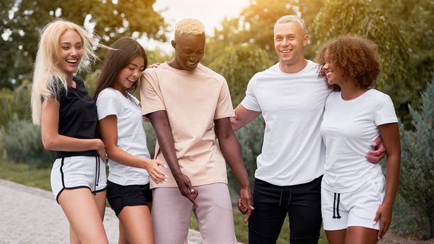 Multi-ethnic group people teenage friends. African-american, asian, caucasian student spending time together Multiracial friendship