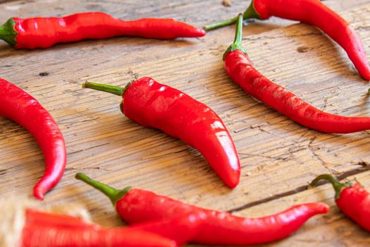 hot chili peppers on wooden background. selective focus