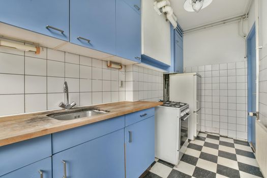 Simple kitchen in attic studio apartment