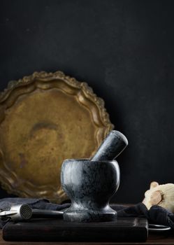 Black stone mortar on a wooden table