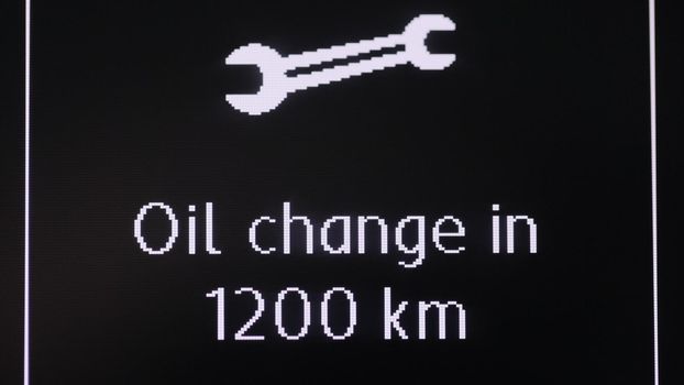 Icon service for replacement of oil fluids of the car. Car dashboard with oil change sign