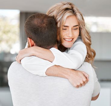 Excited woman hugging her boyfriend. Husband carrying his wife. Happy girlfriend hugging her boyfriend.Romantic couple hugging at home. Caucasian couple affectionately embracing.